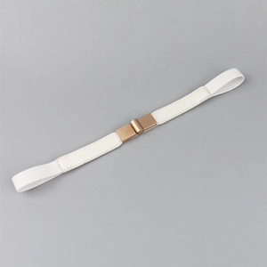 Close-up of white elastic waist belt featuring a rose gold square buckle and lychee texture