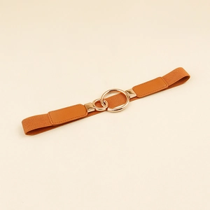 Detail view of brown elastic waist belt with double interlocking golden rings and faux leather