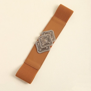Macro shot of vintage caramel leather waist belt with ornate metal buckles and elastic band
