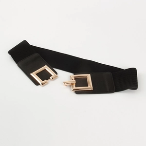 Detail shot of black elastic waist belt with a golden square metal buckle for women