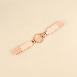 Detail of pink elastic waist belt with interlocking double gold rings and leather ends