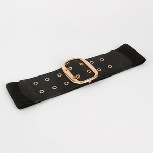 Detail of wide black waist belt with gold oval buckle and metallic eyelet accents