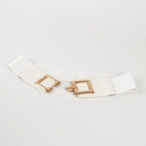 Close-up of white elastic belt with gold square metal buckle for women's waist styling