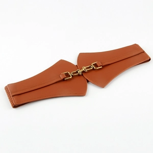 Detail showing the vintage tan leather corset belt with its golden metal chain buckle