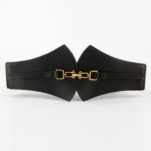 Detail of black wide elastic waist belt with vintage gold equestrian style metal buckle