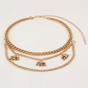 Detail of gold triple-layered waist chain featuring elephant pendants and lobster clasp
