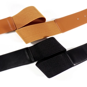 Detail shot of black and brown high-elasticity wide belts with textured leather finish