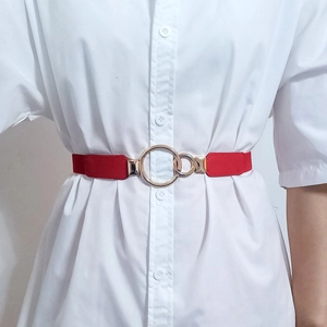 Red elastic waist belt for women with golden double ring buckle on white shirt
