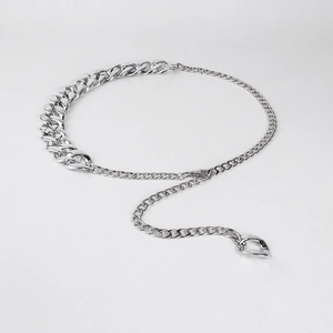 Detail of silver dual-link chunky chain waist belt with geometric pendant decoration