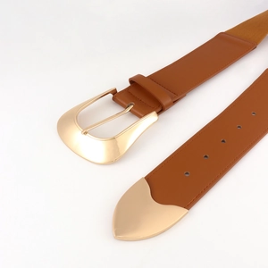 Detail of western style wide elastic waist belt with gold metal buckle and leather trim
