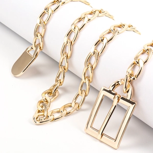 Detailed close-up of gold-tone chunky metal chain belt with rectangular pin buckle