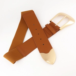 Detail of camel brown elastic waist belt showing golden metal buckle and stitching