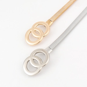 Detail of gold and silver metallic stretch belts with double O-ring interlocking buckles