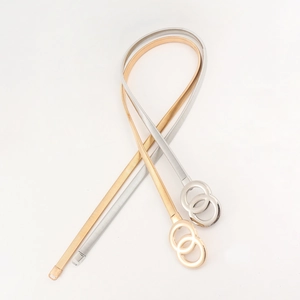 Detail of elegant gold and silver elastic snake chain belts with double ring buckles