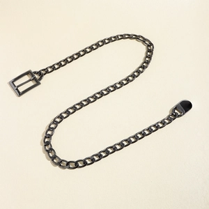 Detail of chunky gunmetal chain link belt with oval rings and polished metallic finish