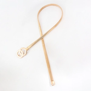 Detailed macro view of the golden metal elastic snake chain belt with double O-ring buckle