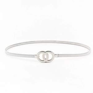 Detailed view of women silver elastic spring belt with minimalist double ring buckle