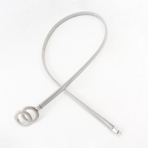 Detailed macro view of silver metallic elastic spring belt with dual circular ring buckle