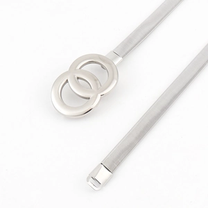 Detail of silver metal elastic belt featuring interlocked double rings and ribbed texture