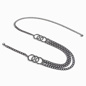 Detailed macro view of triple-layered gunmetal waist chain with decorative rings and lobster clasp