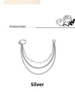 Detailed view of silver triple-layered metal pant chains with sturdy round snap hooks