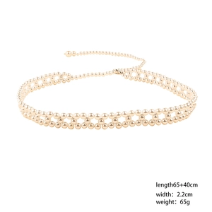 Detail view of woven pearl waist belt with star charm showing length of 105cm