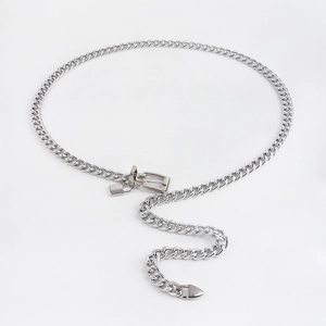 Detail of silver metal waist chain with thick Cuban links and small padlock pendant