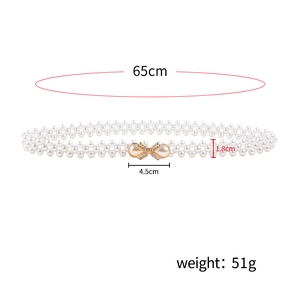 Detail showing dimensions of woven pearl belt with a golden bow buckle and measurements