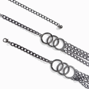 Detail of multi-layer gunmetal chain belt with triple ring accents and lobster clasp