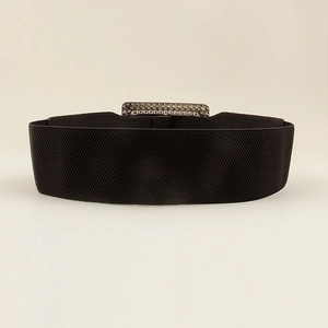 Detail of black elastic corset belt with engraved silver buckle and diamond texture