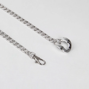 Close-up of silver metal chain with lobster clasp and D-ring for dresses or bags