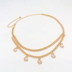 Detail of double-layer gold chain waist belt with rhinestone dragon pendants