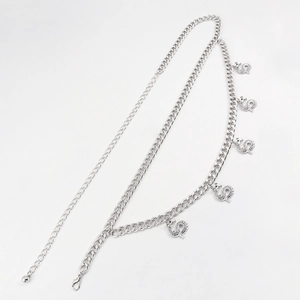 Detail of silver double-layered waist chain featuring five intricate dragon pendants