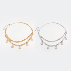 Detail of double-layer gold and silver waist chains with sparkling dragon pendants