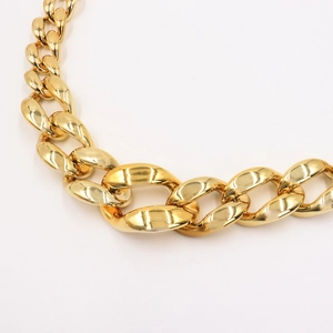 Polished chunky gold cuban link chain belt in a bold punk hip-hop minimalist style
