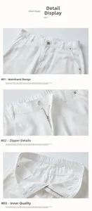 Detailed macro view of white cotton denim trousers showing elastic waist and metal zipper