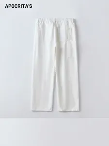 White straight-leg denim jeans with elastic waist and back pockets in a minimalist style