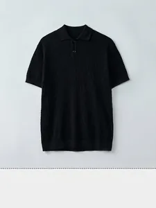Men's black cotton cable knit short sleeve polo shirt with textured diamond pattern