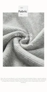 Détail du tissu tricoté gris avec 68,2 % de coton et 31,8 % de polyester à texture gaufrée