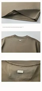 Detailed view of olive brown T-shirt featuring a unique square stitched neck label with SPARK
