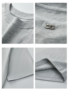 Men's premium light grey crew neck t-shirt with metallic logo detail and high-end stitching