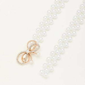 Elegant pearl waist belt with a sparkling rhinestone bow buckle for women's dresses