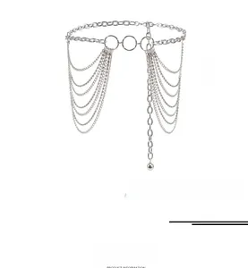 Detail of silver multi-layer punk waist chain with rings and rhinestone tassels
