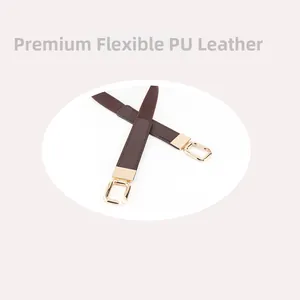 Detail of dark brown elastic belt featuring premium PU leather and gold rectangular buckle