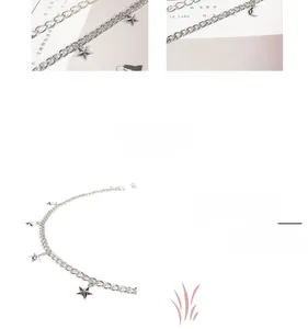 Detailed macro view of silver star and moon charms on a thick chain body belt