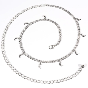 Detail of silver body chain featuring crescent moon pendants and adjustable lobster clasp