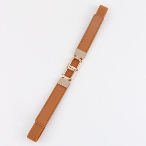 Detail view of caramel brown elastic belt with golden double square metal buckle