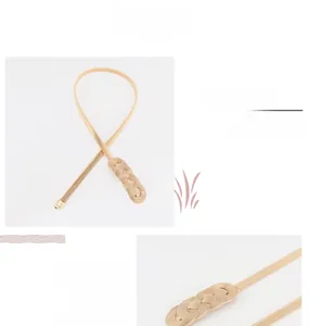 Detail of gold metal spring chain belt with elegant woven alloy buckle for dresses