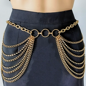 Detail of layered gold chain belt with sparkling rhinestones for punk style outfits