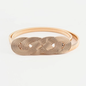 Women's gold elastic metal belt featuring a twisted interlocking buckle on a grey background